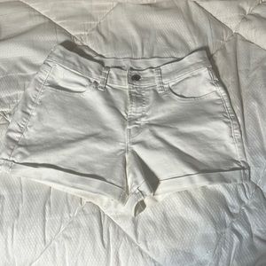 These are a pair of white denim shorts with a fold at the bottom.